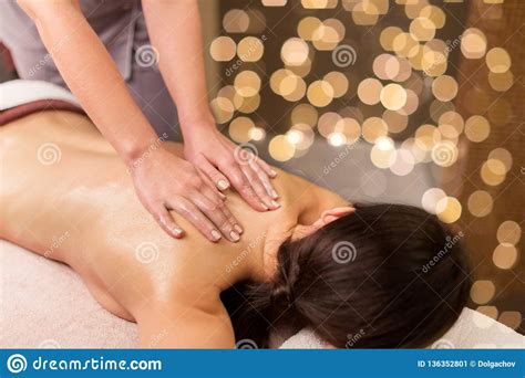 woman lying and having back massage at spa parlor stock image image