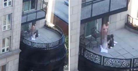 dude gets caught getting a double bj on his balcony the