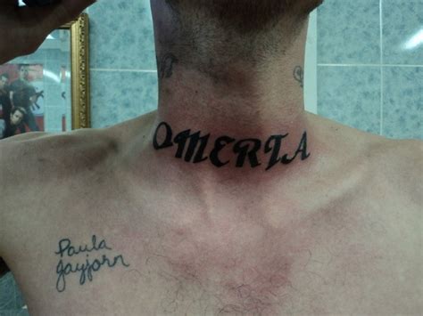 black omerta lettering throat tattoo tattooimages
