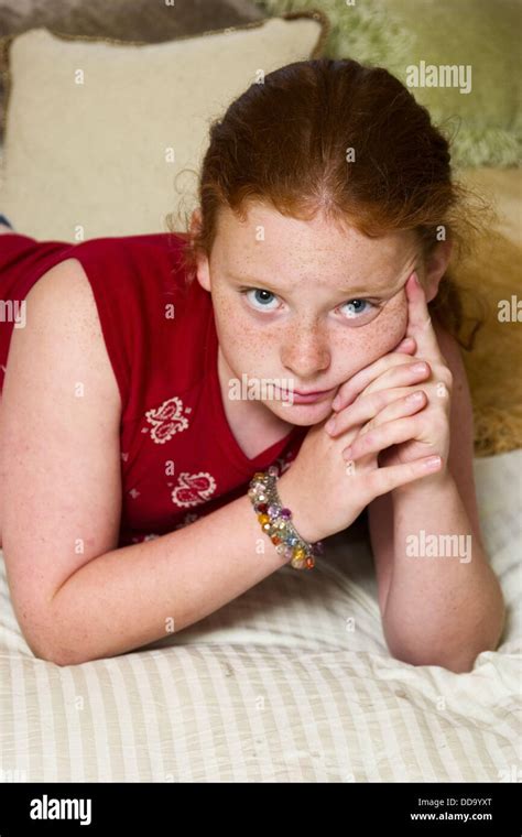Preteen Redhead Girl In Connecticut Usa Reclining On Her Mother´s