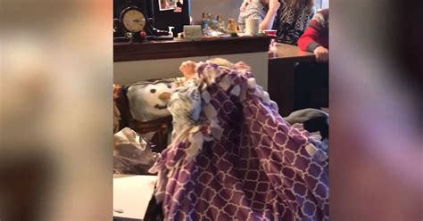 granddaughter gives grandma a special surprise handmade blanket