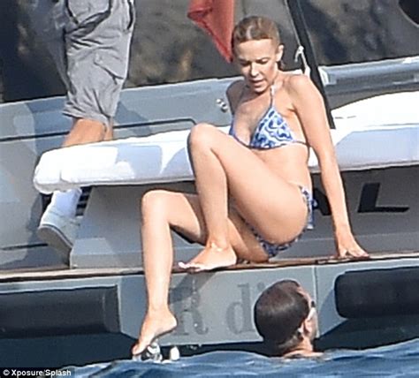 Kylie Minogue Displays Her Flat Stomach And Pert Posterior In Italy