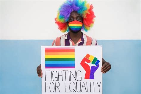 premium photo african man holding lgbt banner at gay pride
