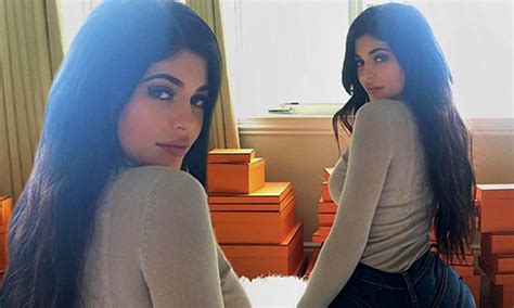 kylie jenner shows off suspiciously larger bottom as she models jeans