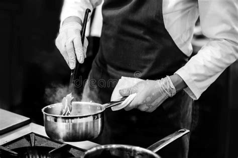 chef cooking   kitchen chef  work black white stock photo image  closeup delicious