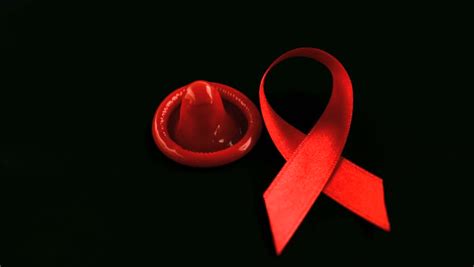 red ribbon falling over on white background in slow motion