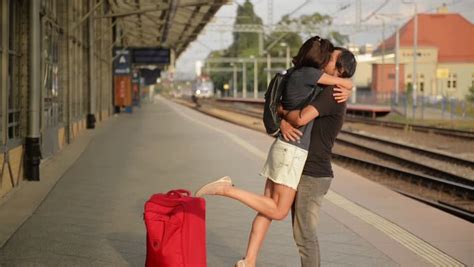 Happy Couple Embracing On Railway Station Platform Farewell At The