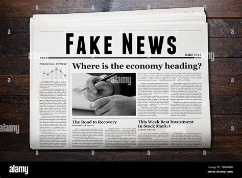newspaper showing fake news  headline stock photo alamy