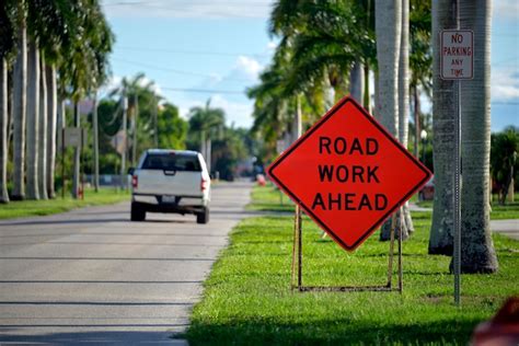 premium photo road work  sign  street site  warning  cars