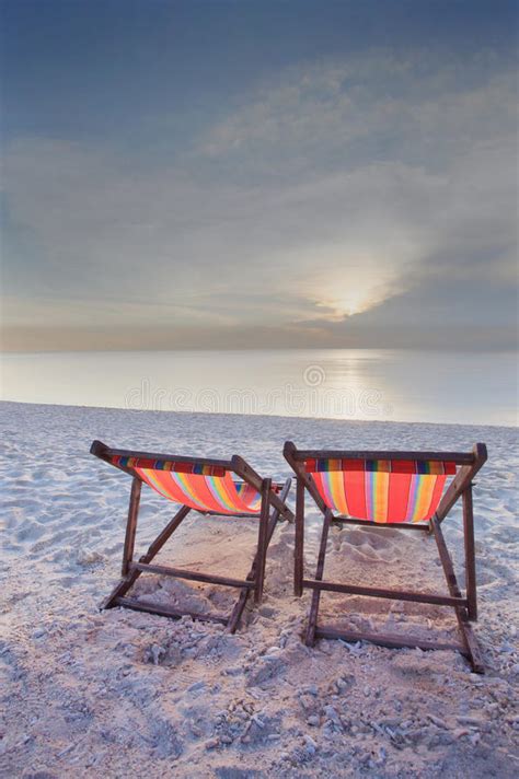 Couples Of Chairs Beach On White Sand With Dusky Sky