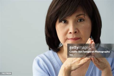 Mature Asian Woman Serious Imagens E Fotografias De Stock Getty Images