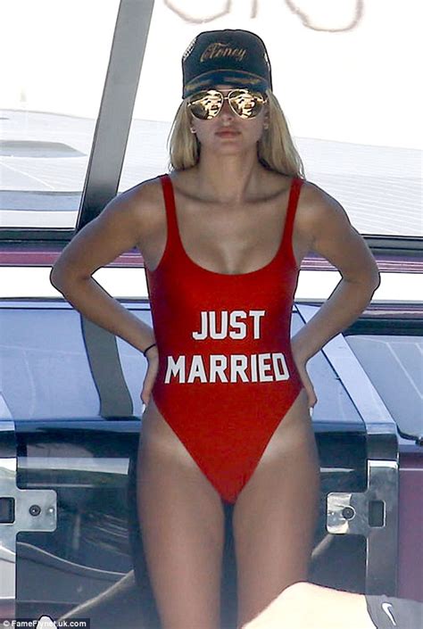 hailey baldwin wears a skimpy red swimsuit for 4th july celebrations