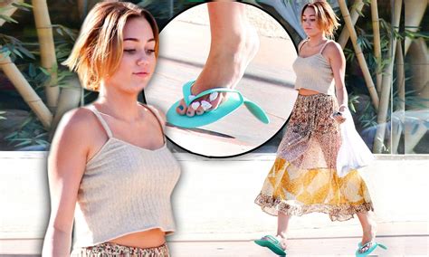 Miley Cyrus Tries To Run In Long See Through Skirt And Paper Flip Flops