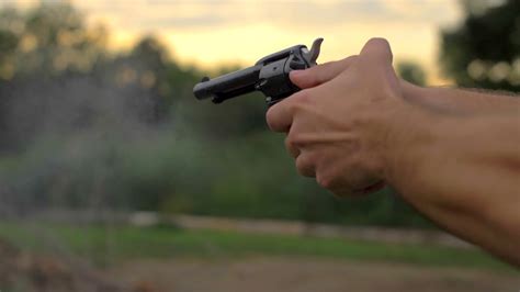 4k Slow Mo 60 Fps 22mm Hand Gun Revolver Shells Shooting Target