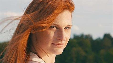 tall sporty woman with beautiful red hair on motorboat view from behind stock video footage