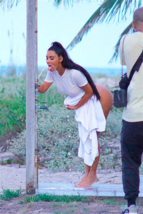 kim kardashian comes awkwardly close to flashing too much in impossibly tiny thong mirror online