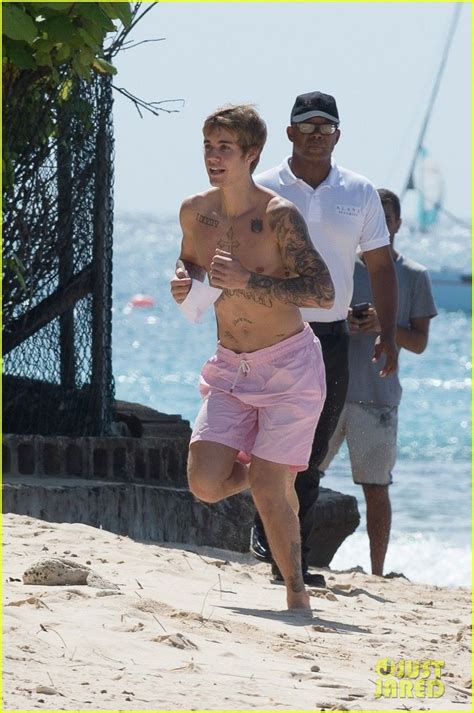 justin bieber s body is ripped in new shirtless beach photos