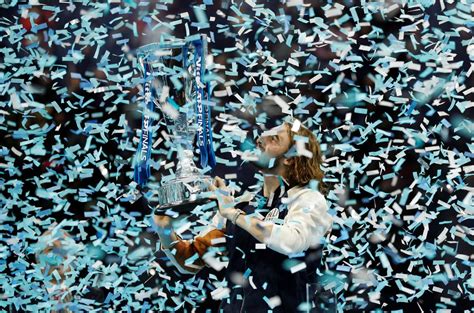 tsitsipas fights back to beat thiem and claim atp finals