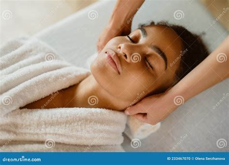 Beautiful African American Woman Having Massage Of The Head In Beauty