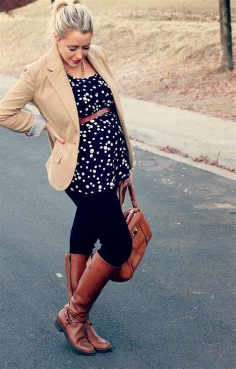 picture of black jeans a dotted flowy top brown boots and a tan jacket