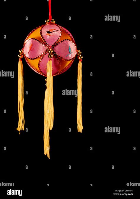 red silk ball  yellow tassels stock photo alamy