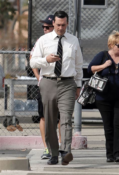 jon hamm checks his phone while forgetting to check for his underwear on the set of mad men