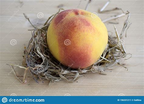 The Peach Is On A Wooden Table Fruit Is Large Yellow Fresh Ripened