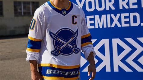 sabres reverse retro brings goat head  royal blue  gold jersey