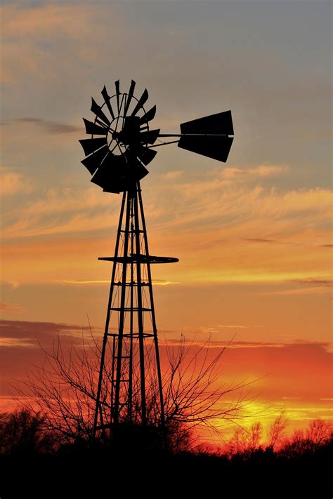 kansas golden sunset   windmill silhouette    country windmill farm windmill
