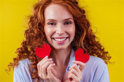 sex education concept redhaired ginger curly woman holding