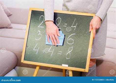 woman cleaning blackboard stock image image  eraser