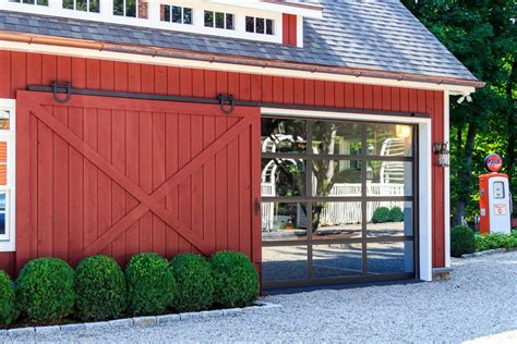sliding barn door open revealing glass garage door barn garage barn door garage barn