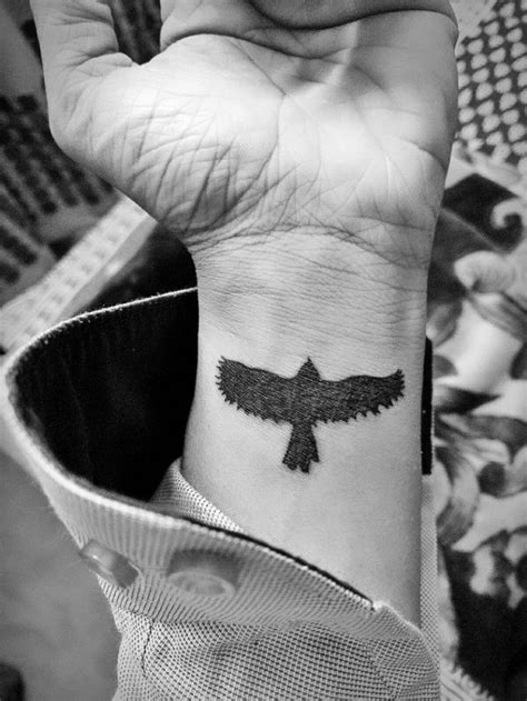 bird  flight tattooed  black   wrist   man   long