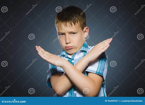 boy making  sign   arms  stop   stock