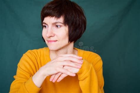 Smiling Mature Brunette Woman Looking Away Playful And Defiant Close