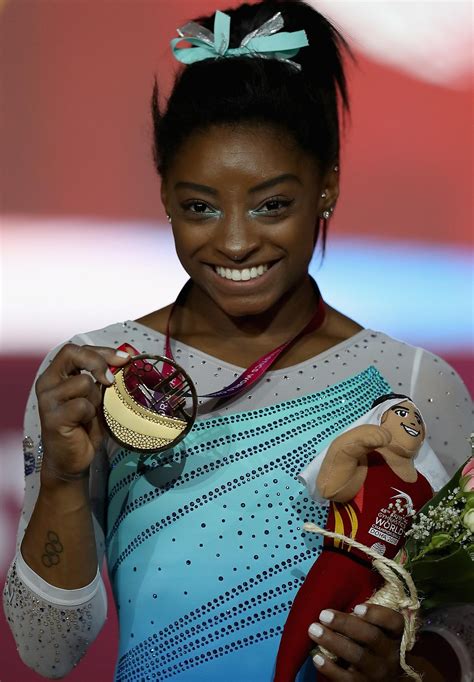 simone biles    win    titles  worlds