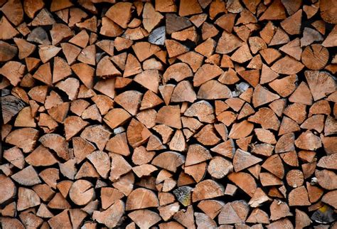 split firewood neatly stacked  winter  kathy bovee photo stock studionow