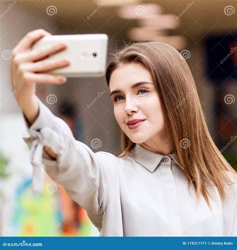 beautiful girl makes selfie in the shopping mall stock image image
