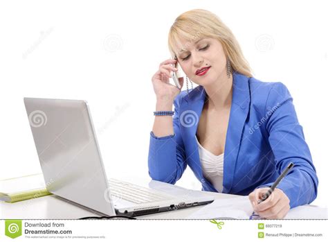 Attractive Blonde Secretary Sitting At Her Desk On Phone