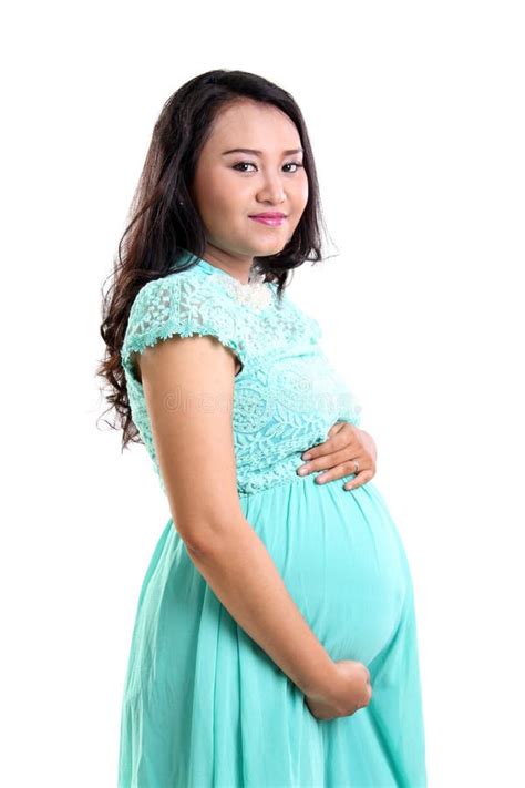 mature pregnant lady holding  stomach stock photo image  happy