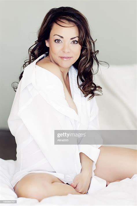 beautiful 40year old woman on a bed bildbanksbilder getty images