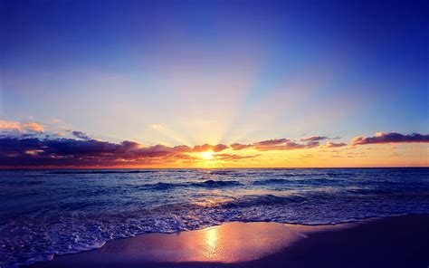 beautiful sunset sun sea waves beach clouds wallpaper