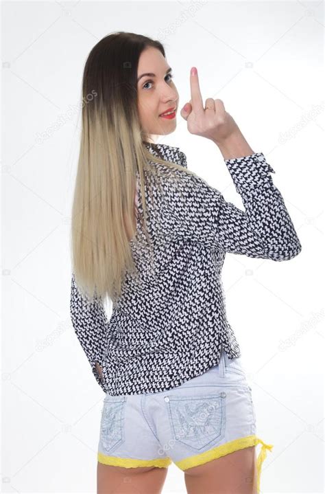 sporty girl in jeans shorts with fit ass show middle finger fuck you off sign between her legs