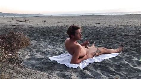 He S Laying Out On The Beach Whacking Off