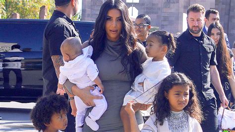 chicago west looks like a model while posing with saint and psalm