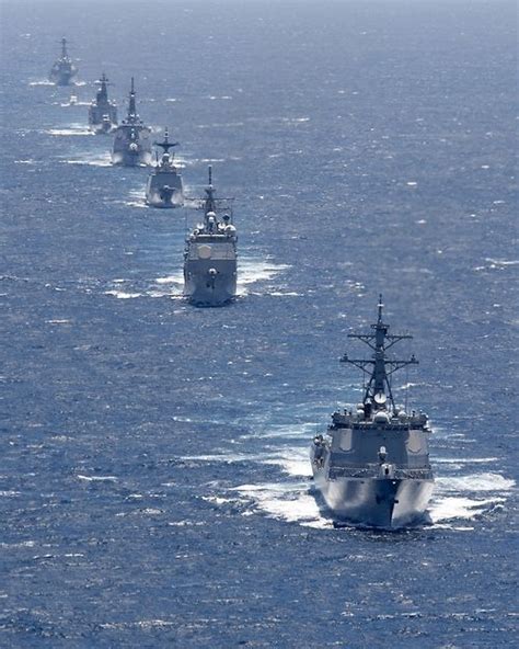 a formation of ships from the u s navy u s coast guard japan