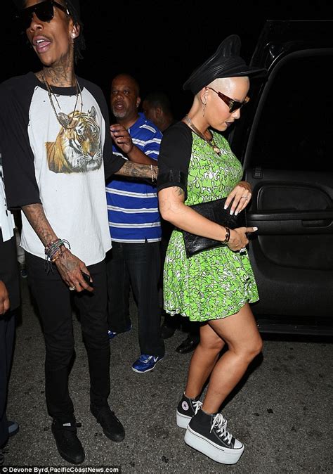 Amber Rose Swigs Champagne And Gets Cosy With Lil Kim On Date Night