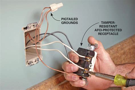 man  working   electrical outlet