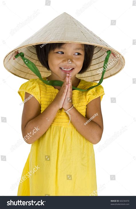 cute little uptown girl with vietnamese style hat and typical asian welcome expression isolated