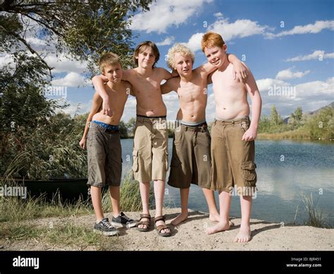 boys playing   lake stock photo alamy